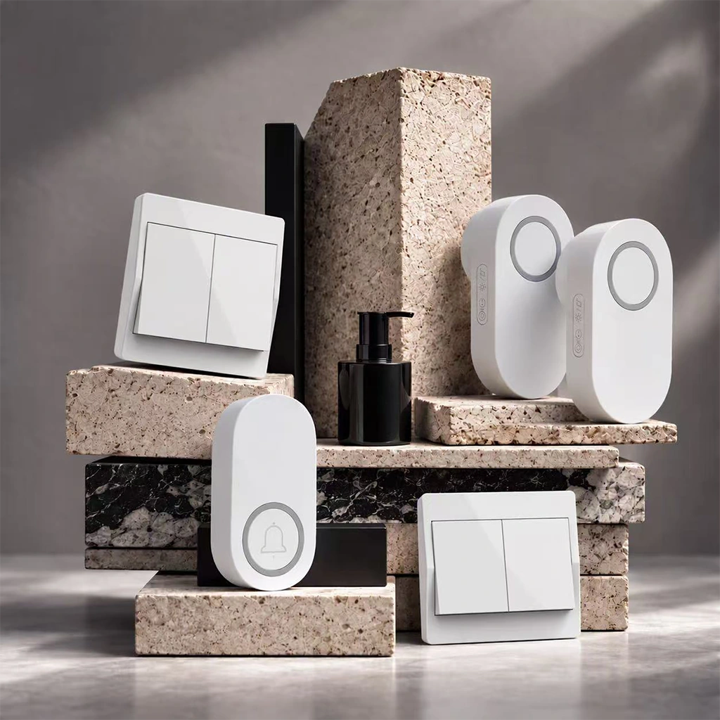 X-Lazy flagship eco-friendly systems and kits bundle featuring 301FS-2G-1V2 battery-free kinetic wireless light switches and QX-009-1V2 self-powered wireless doorbells arranged on natural stone stands.⁠
